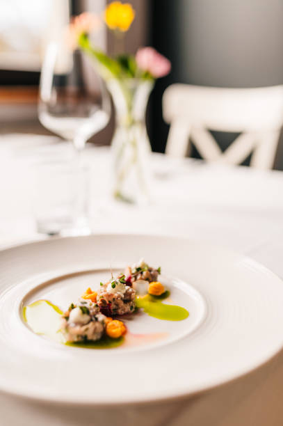 istock Carp, apples and herbs on a plate 2203807023