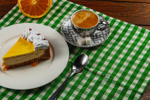 istock Citrus cheesecake with espresso on a cozy table setting 2203807310