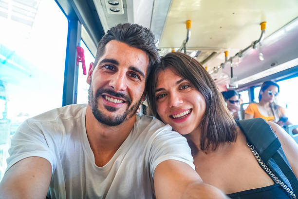 istock Young couple taking selfie on philippines airport bus 2203807802