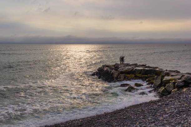 Man fishing at the seaside
