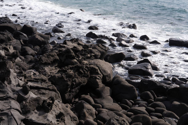 istock High-angle view of the cliff and rocky beach 2203809144