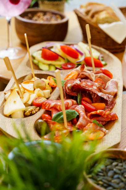 istock Charcuterie board with bread, cheese, and salad 2203810233