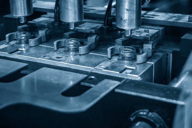 istock The drinking water bottle manufacturing process by blow mold machine. 2203811162