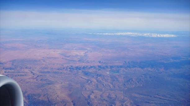 istock Airplane wing flying over Morocco desert and Atlas mountains landscape 2203812749