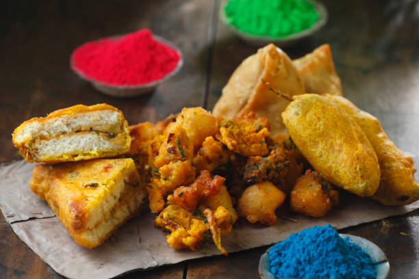 istock mix pakora ( bread pakora, onion pakora, moong dal pakora, mirchi vada, samosa, aloo pakora) with holi color 2203817220