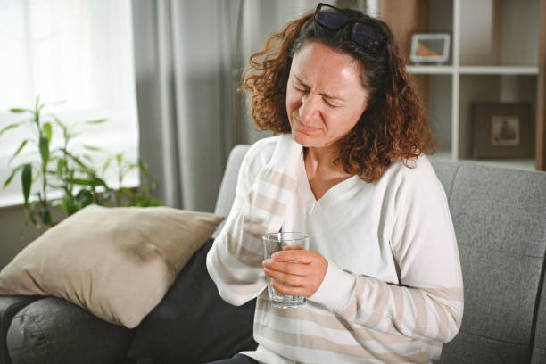 istock woman suffering from heatstroke at home 2203821744
