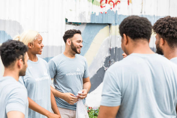 istock Group of diverse volunteers collaborating on a community project 2203823019