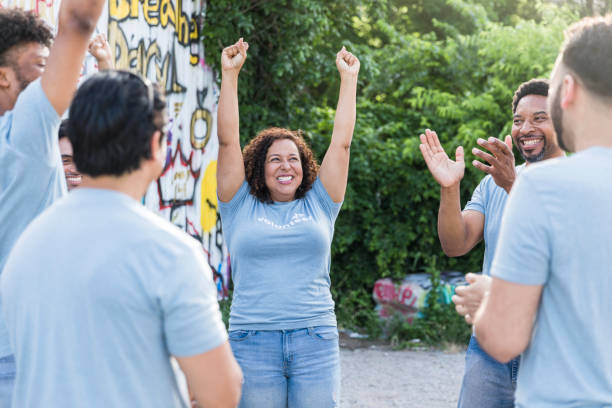 istock Celebrating Success: Multiracial Group of Volunteers Rejoicing 2203823066