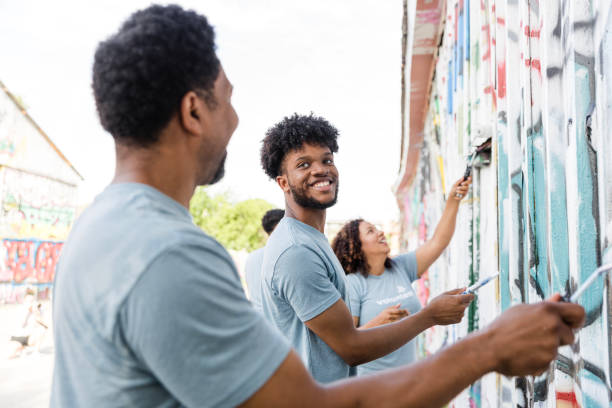 istock Volunteers Painting a Mural Together, Community Teamwork 2203823078