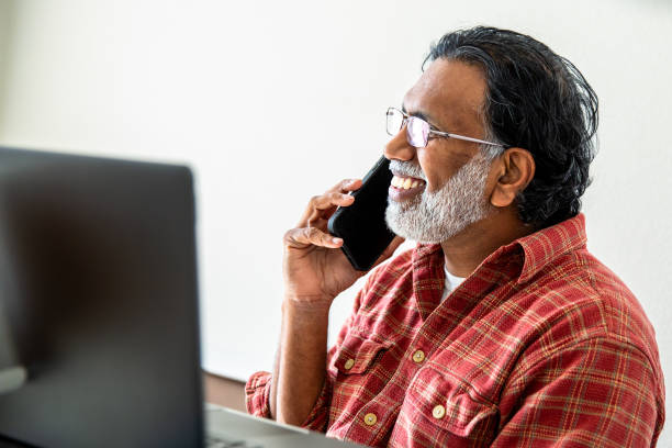 istock Mature Indian Man Working from Home Office at Laptop 2203824036