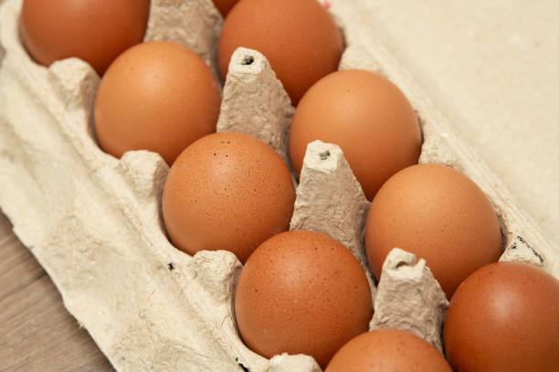istock A dozen fresh brown eggs are neatly arranged in a carton on a kitchen countertop, ready for various culinary uses such as baking or cooking delicious meals 2203825616