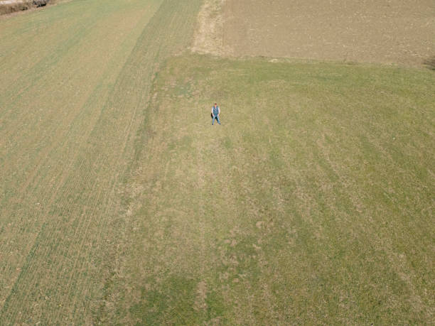 Farmer at his agricultural field in early springtime
