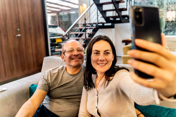 istock Mature couple taking a selfie at home 2203827710