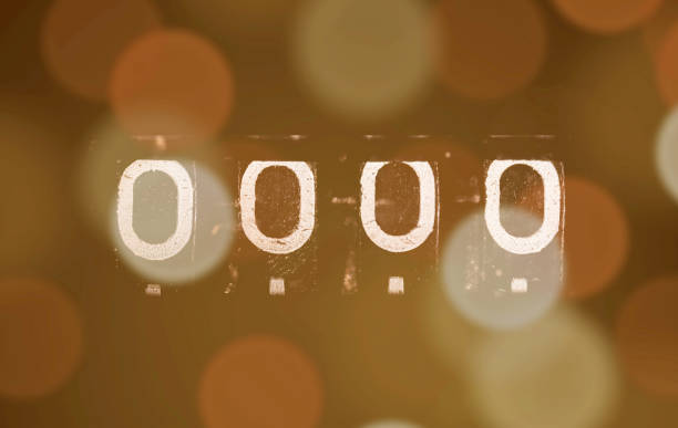 istock Odometer displays four zeros on a blurry warm bokeh background 2203828893