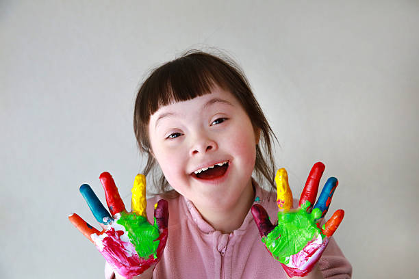 istock Cute little girl with painted hands 2203829357