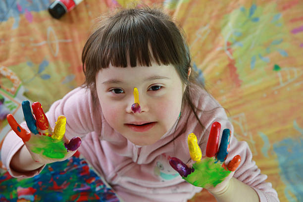 istock Cute little girl with painted hands 2203829371