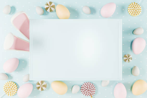 istock Colorful Easter eggs and candies surround a blank card on a pastel background, celebrating the holiday spirit. 3d rendering 2203830461
