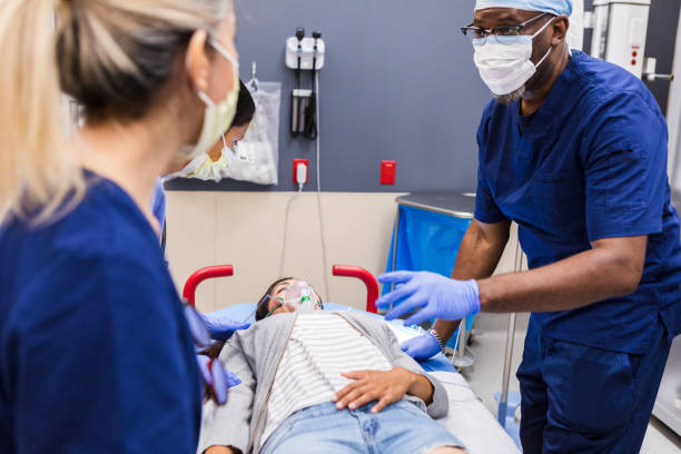 istock Emergency Room: Doctor and Nurses Attending to Patient 2203831481