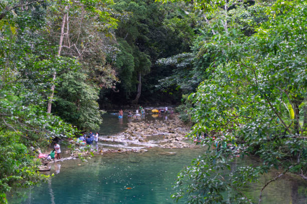 Local Pilipino people washing clothes in a river in Bohol.