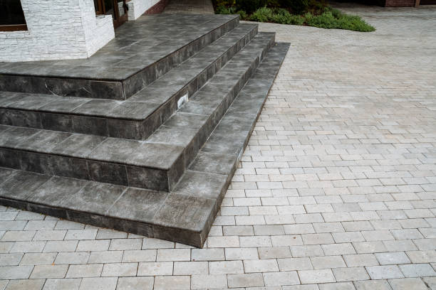 istock A beautifully designed brick walkway with stairs leading up to a house 2203838318