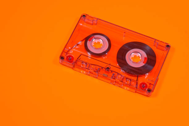 istock Retro audio cassettes on orange background 2203838746