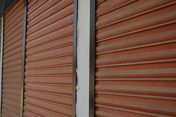 istock rusty metal shop shutter close photo 2203842578