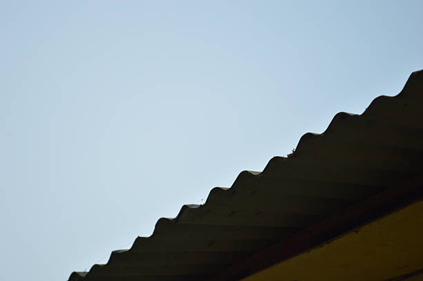 roof design triangle shape overlap of building against blue sky