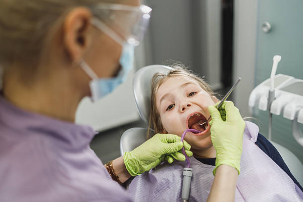 istock Little Girl At The Dentists Office 2203844060