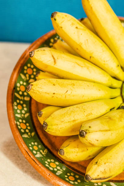 istock bananas on the market 2203844094