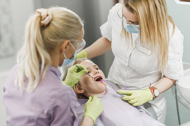 istock Little Girl At The Dentists Office 2203844117