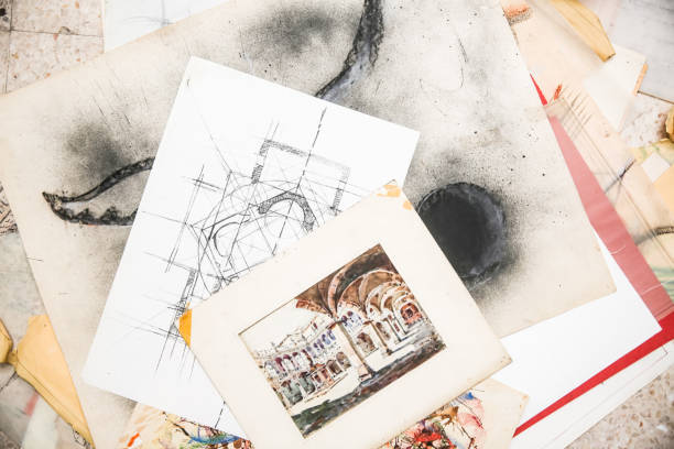 Various architectural drawings displayed from a top view, detailing the intricate plans for a construction project. Highlights meticulous design, structural blueprints, and comprehensive planning for a building.