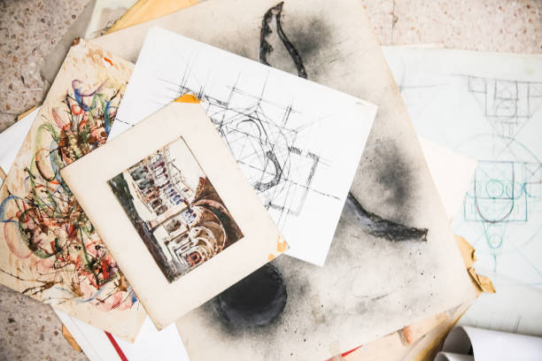 Various architectural drawings displayed from a top view, detailing the intricate plans for a construction project. Highlights meticulous design, structural blueprints, and comprehensive planning for a building.