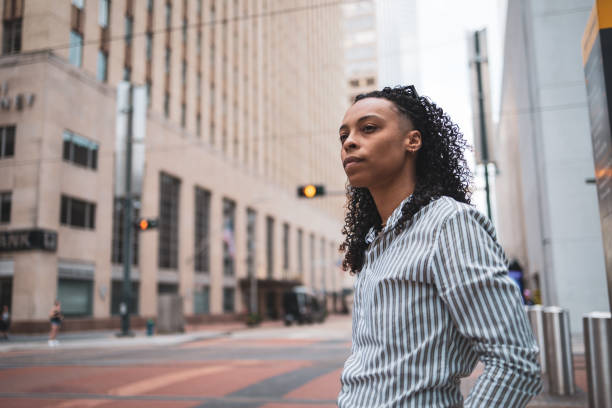 istock Confident Woman Standing in Urban Downtown Environment 2203844605