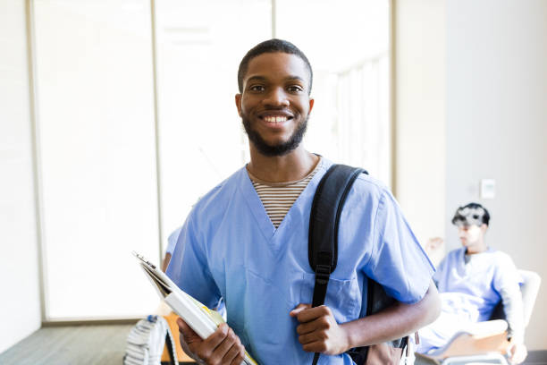 istock Confident Medical Student Carrying Books and Backpack 2203846256