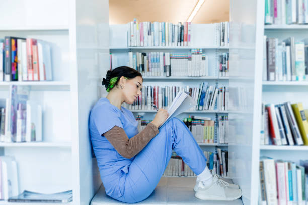 istock Young Female Medical Student Studying in Library 2203846286