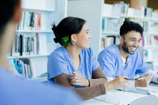 istock Smiling Medical Students Discussing in a Classroom 2203846294