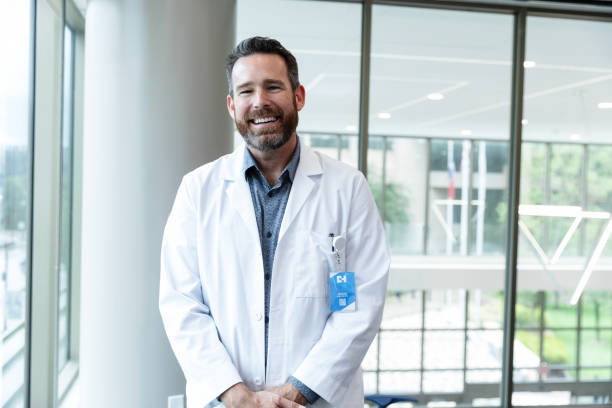 istock Smiling Doctor in Lab Coat at Hospital 2203851044