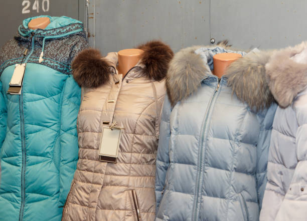 istock Winter beauty jackets on mannequins with fur collars on display 2203851443