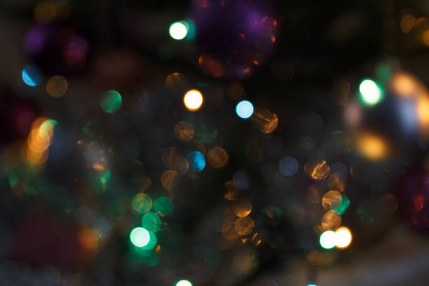 istock Abstract festive bokeh lights in warm and cool tones on dark background 2203859020
