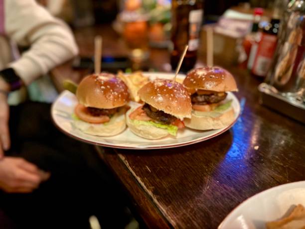 istock Mini burgers for snack served at pub cafe bar 2203860788