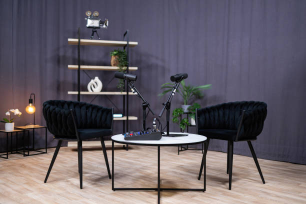 Podcast studio setup with microphones and chairs ready for recording