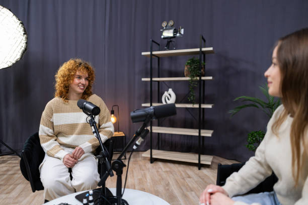 istock Two content creators recording a podcast in a modern studio 2203861563