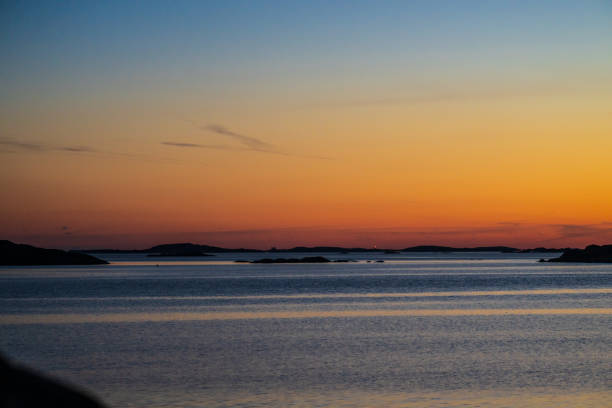 istock Blue and orange glow after sunset over the coast.. 2203867725