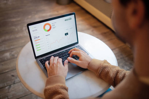istock Data Analyst Reviewing Business KPIs on Modern Laptop in Office Environment 2203869452