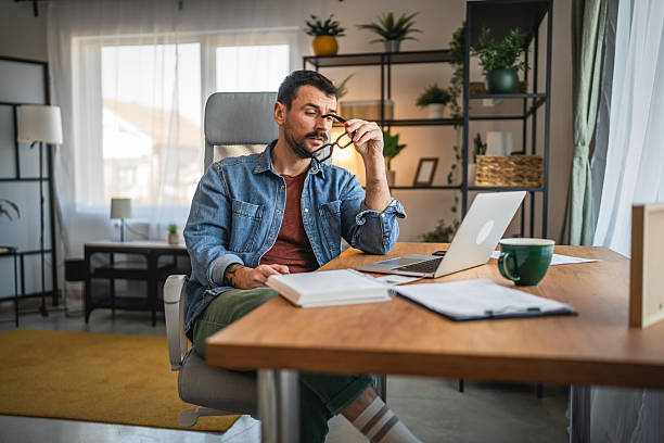 istock focused concentrated man work on laptop from home office 2203869755