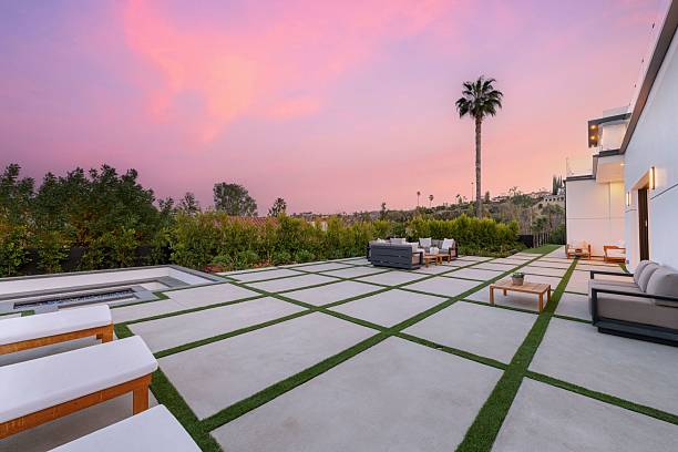 istock Luxury Outdoor Patio with Pool, Stylish Seating, and Sunset Views 2203875615