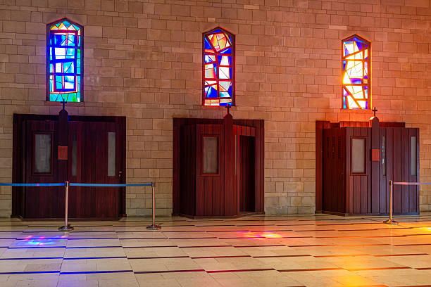 Confessional booths made of beautiful dark wood in the Church of the Annunciation in Nazareth, Israel