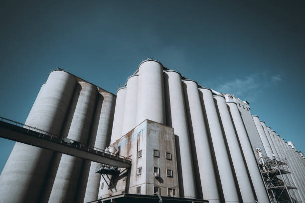 Industrial silo towers for bulk coal storage at the coal terminal in the port of Rotterdam in The Netherlands during a sunny day at the Maasvlakte close to the North Sea.