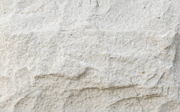 istock [4k] Close-up of White Crushed Stone Texture 2203883942