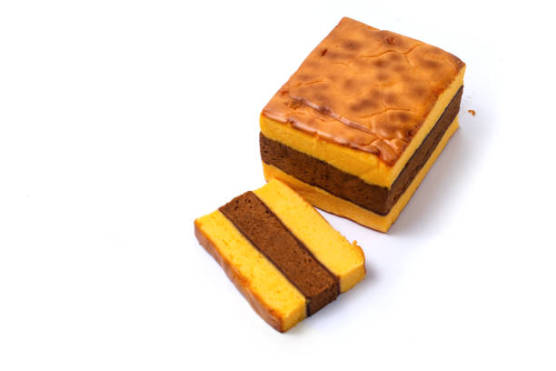 istock Lapis Surabaya or Surabaya layer cake, is an Indonesian three layer rich sponge cake and strawberry jam in between, isolated on white background 2203904223